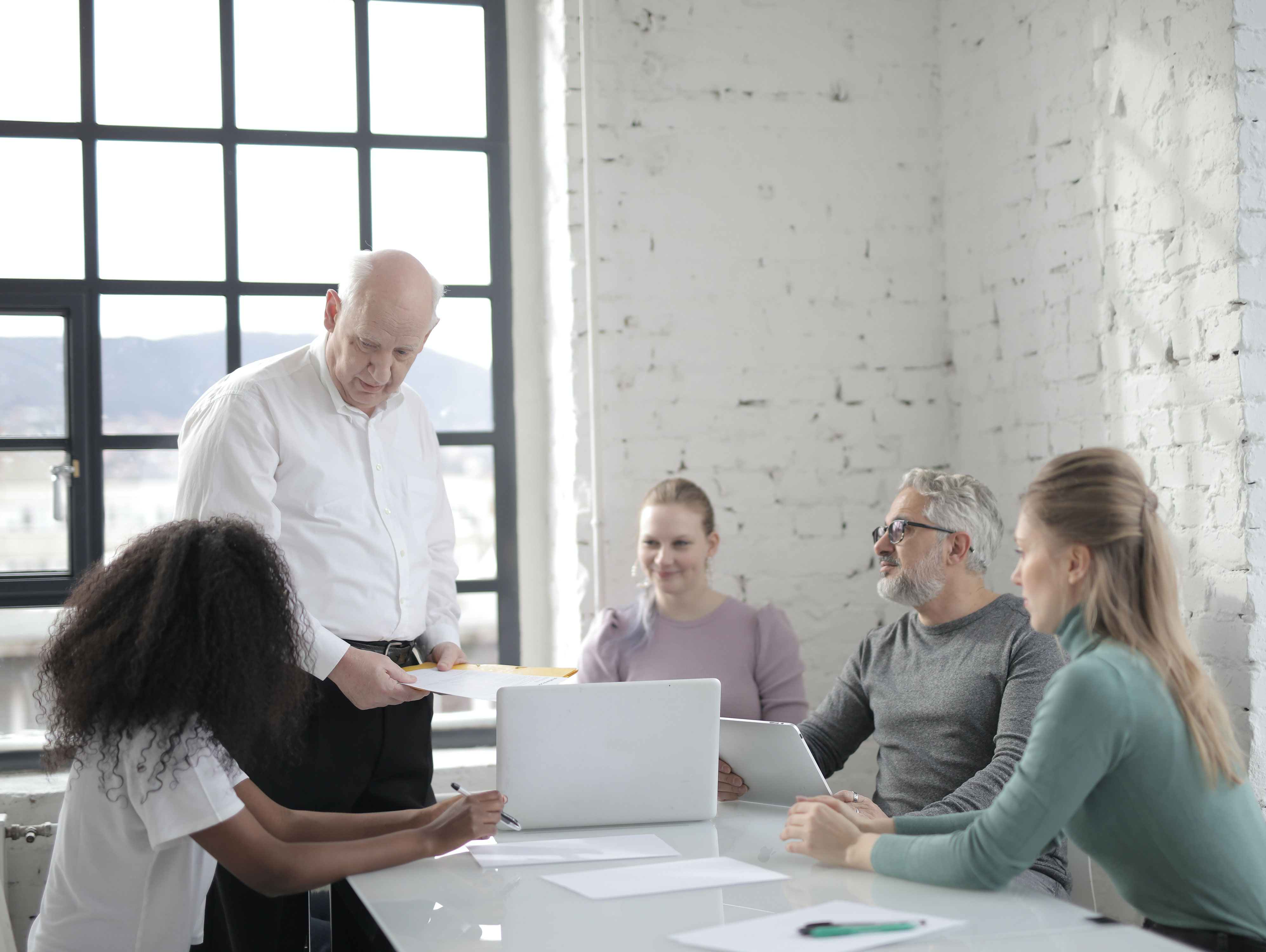 Image credits: https://www.pexels.com/photo/senior-leader-explaining-strategy-to-diverse-coworkers-3860652/